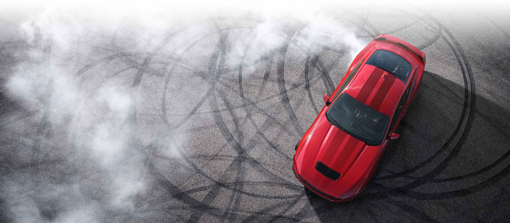 Overhead view of a 2024 Ford Mustang® model with tire tracks on pavement | Edd Rogers Valley Ford in Sparta TN