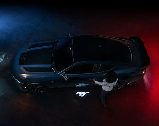 2024 Ford Mustang® Dark Horse™ model with a driver approaching the vehicle | Edd Rogers Valley Ford in Sparta TN