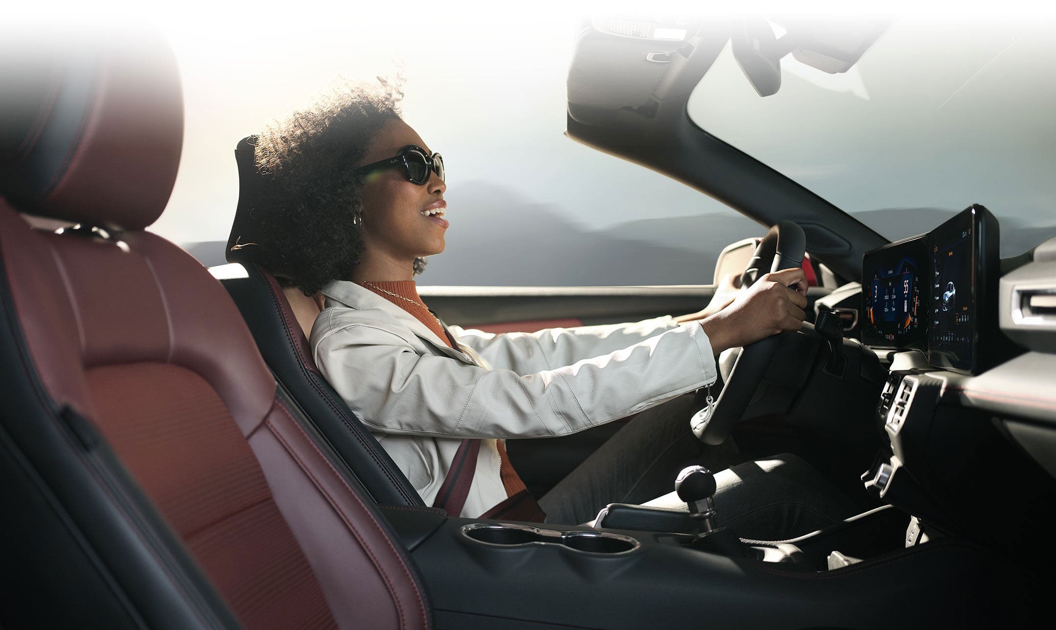 Person sitting in the driver’s seat of a 2024 Ford Mustang® convertible | Edd Rogers Valley Ford in Sparta TN